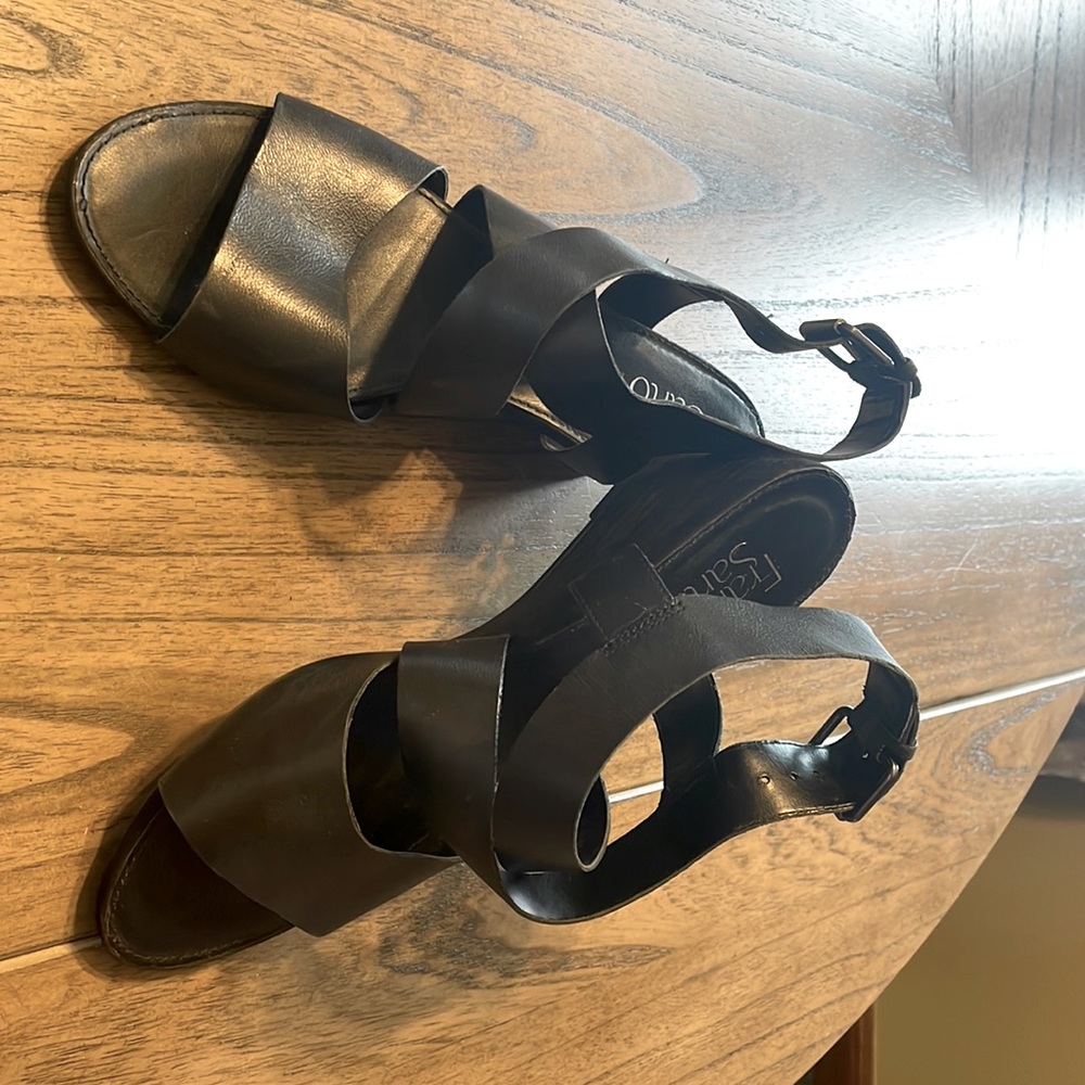 Black leather, buckle sandal. 2.5” heal. Only worn once.